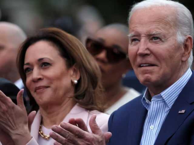 us president joe biden claps hands next to us vice president kamala harris while hosting a juneteenth concert on the south lawn at the white house in washington d c u s june 10 2024 photo reuters